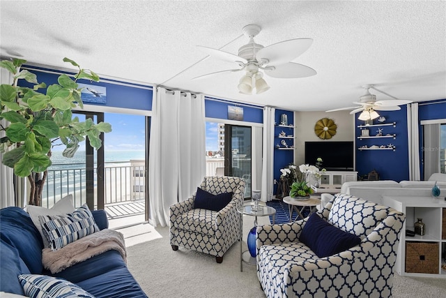 5207 S Atlantic Ave Unit 626, New Smyrna Beach, FL 32169 - carpeted living room with a textured ceiling and a ceiling fan