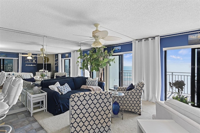 5207 S Atlantic Ave Unit 626, New Smyrna Beach, FL 32169 - living room featuring a textured ceiling and a ceiling fan