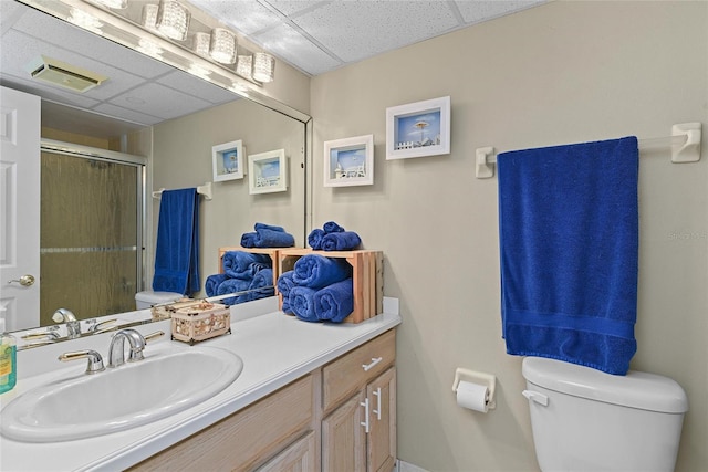 5207 S Atlantic Ave Unit 626, New Smyrna Beach, FL 32169 - full bath featuring a paneled ceiling, a shower stall, vanity, toilet, and visible vents