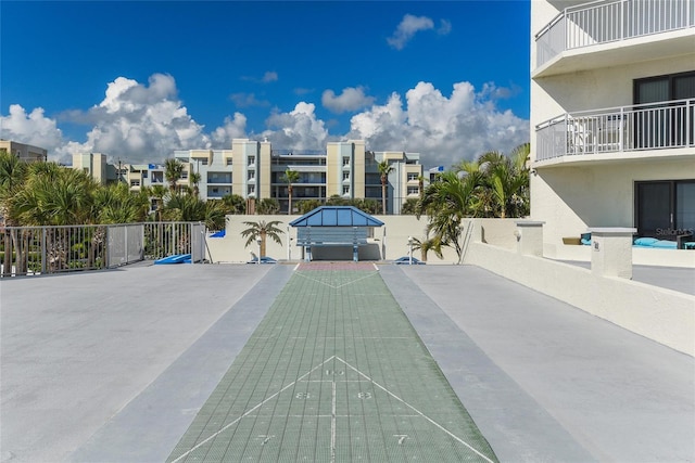 5207 S Atlantic Ave Unit 626, New Smyrna Beach, FL 32169 - view of community with shuffleboard and fence