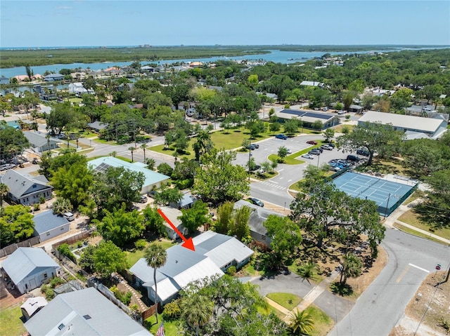 birds eye view of property with a water view and a residential view