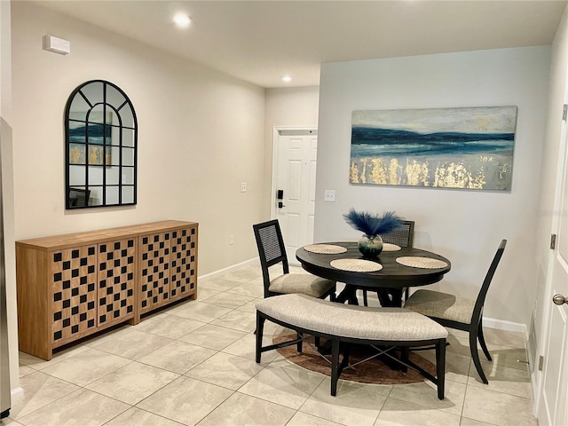 dining room with baseboards, recessed lighting, and light tile patterned flooring