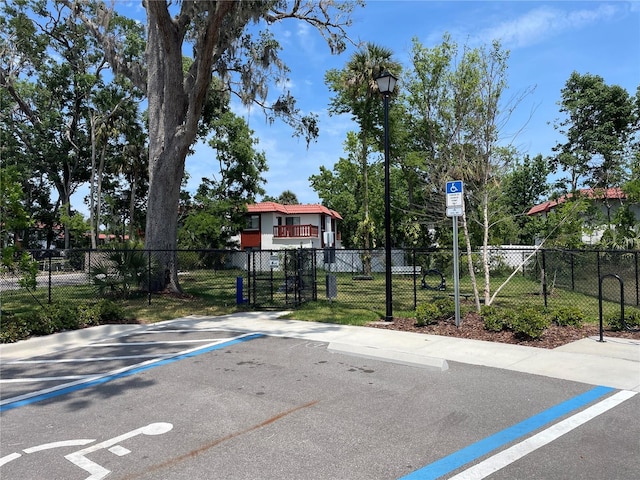 view of sport court featuring fence