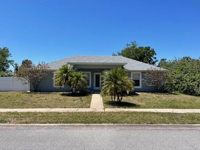 2091 Maltese Ln, New Smyrna Beach, FL 32168 - view of front of home with a front lawn and fence