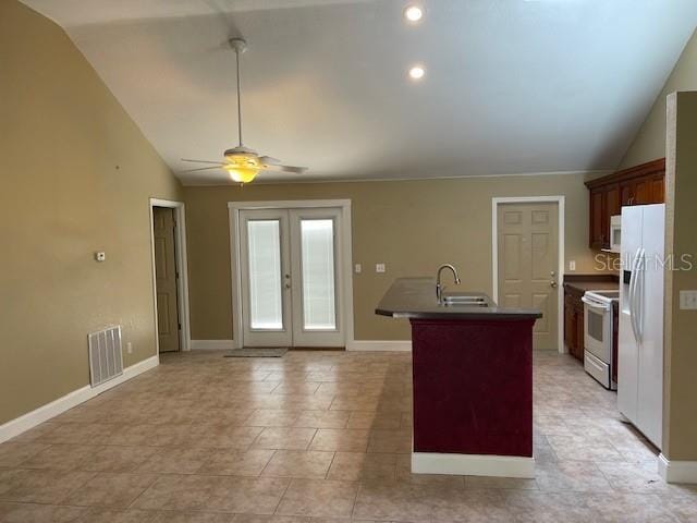 2091 Maltese Ln, New Smyrna Beach, FL 32168 - kitchen featuring lofted ceiling, visible vents, a sink, white appliances, and ceiling fan