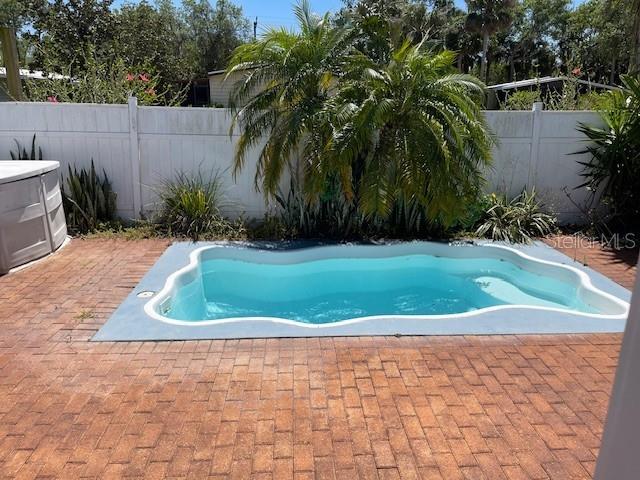 2091 Maltese Ln, New Smyrna Beach, FL 32168 - view of pool featuring a fenced backyard, a pool, and a patio