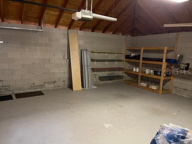 2091 Maltese Ln, New Smyrna Beach, FL 32168 - interior space featuring concrete block wall and a garage