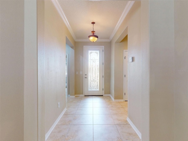 doorway with crown molding, baseboards, and light tile patterned flooring