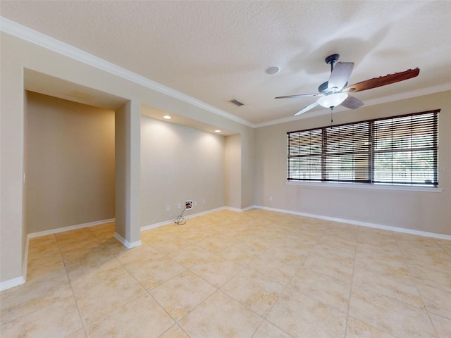 tiled spare room with ceiling fan, a textured ceiling, baseboards, visible vents, and ornamental molding