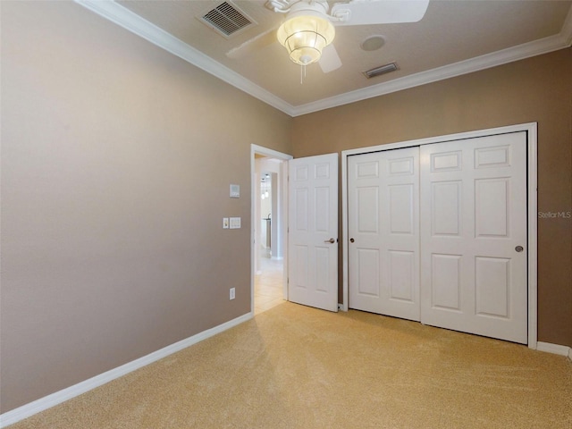 unfurnished bedroom featuring visible vents, ornamental molding, baseboards, and light carpet