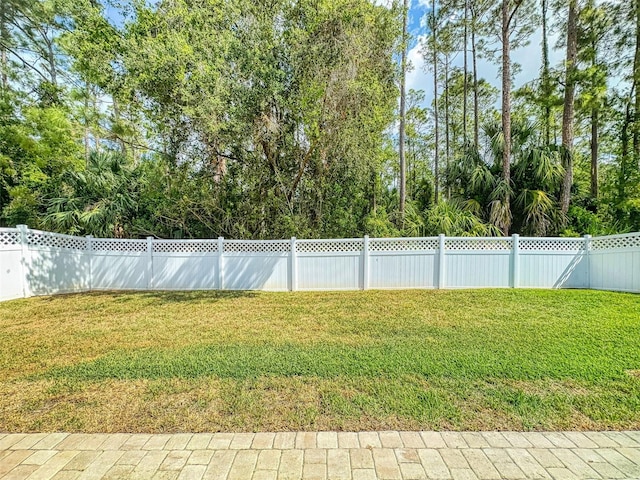 view of yard with a fenced backyard