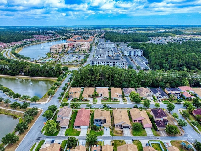 birds eye view of property featuring a water view and a residential view