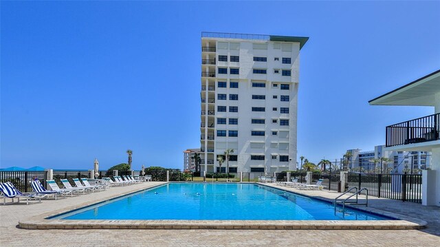 5499 Atlantic Unit 104, New Smyrna Beach, FL 32169 - pool featuring fence and a patio