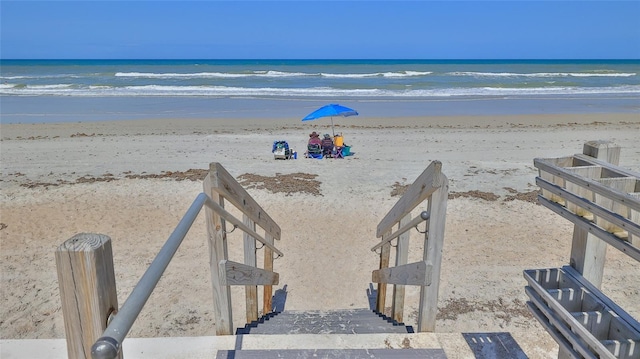 5499 Atlantic Unit 104, New Smyrna Beach, FL 32169 - property view of water featuring a beach view