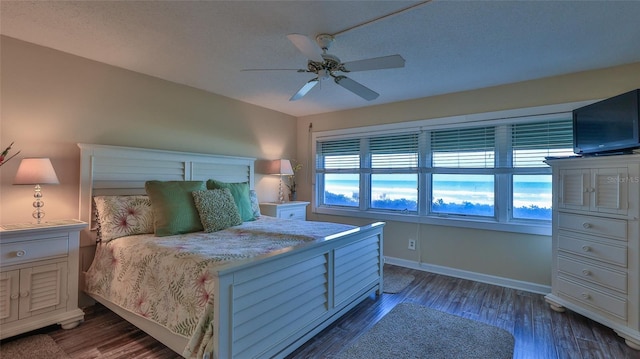 5499 Atlantic Unit 104, New Smyrna Beach, FL 32169 - bedroom featuring wood finished floors, baseboards, and ceiling fan