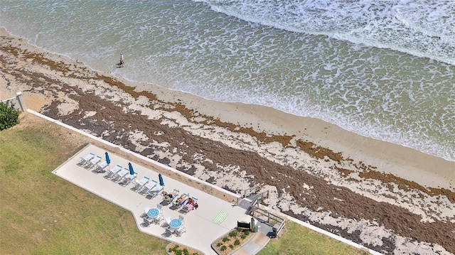 5499 Atlantic Unit 104, New Smyrna Beach, FL 32169 - drone / aerial view featuring a water view and a beach view