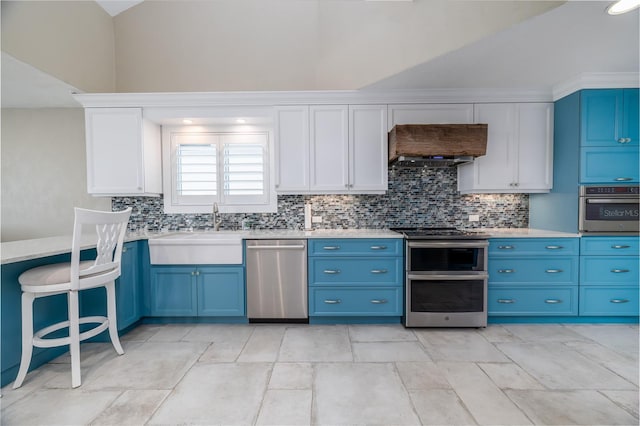 6260 S Atlantic Ave, New Smyrna Beach, FL 32169 - kitchen with a sink, light countertops, appliances with stainless steel finishes, decorative backsplash, and blue cabinets