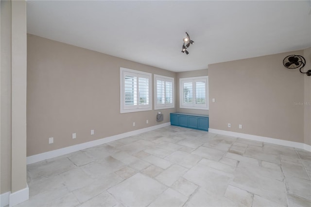 6260 S Atlantic Ave, New Smyrna Beach, FL 32169 - empty room featuring baseboards