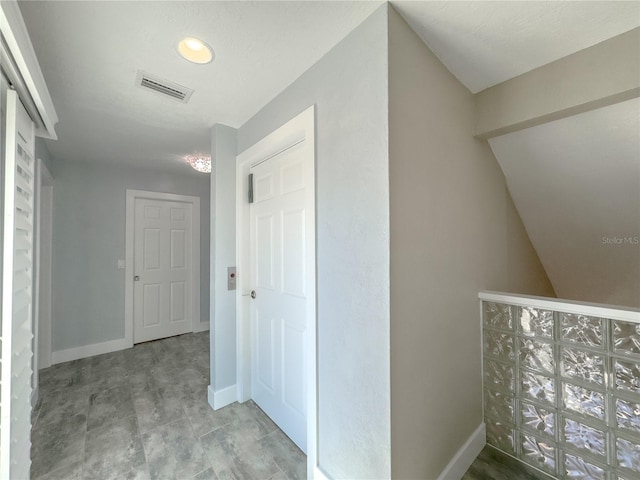 6260 S Atlantic Ave, New Smyrna Beach, FL 32169 - corridor with baseboards and visible vents