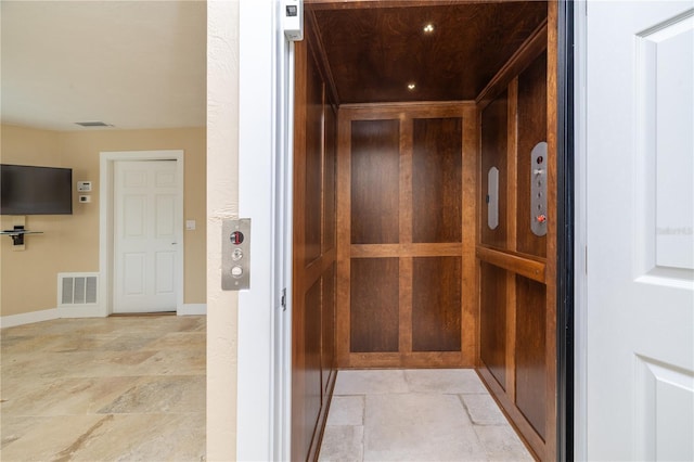 6260 S Atlantic Ave, New Smyrna Beach, FL 32169 - room details featuring baseboards, elevator, and visible vents