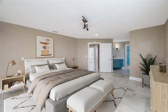 6260 S Atlantic Ave, New Smyrna Beach, FL 32169 - bedroom featuring ensuite bath, baseboards, and visible vents
