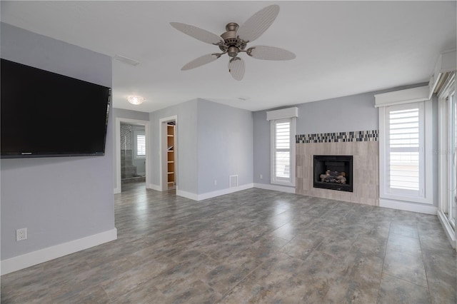 6260 S Atlantic Ave, New Smyrna Beach, FL 32169 - unfurnished living room featuring a fireplace, ceiling fan, baseboards, and visible vents