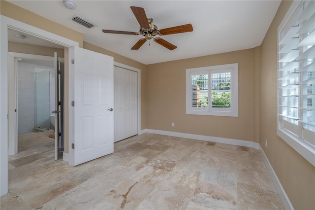 6260 S Atlantic Ave, New Smyrna Beach, FL 32169 - unfurnished bedroom with a closet, visible vents, baseboards, and ceiling fan