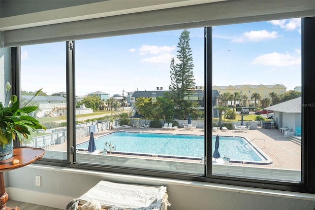 view of pool with a residential view
