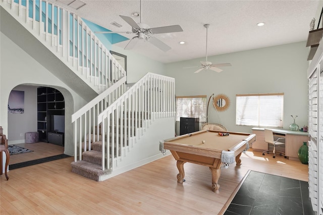 playroom with wood finished floors, recessed lighting, a ceiling fan, and arched walkways