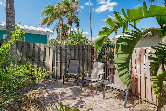 view of patio featuring fence