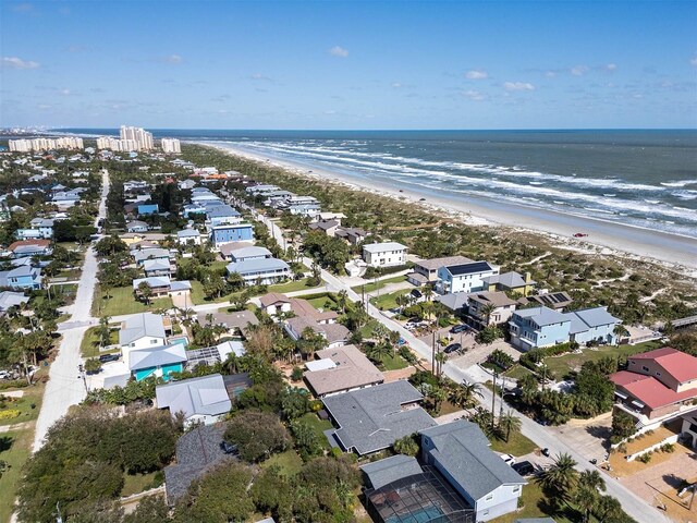 bird's eye view with a beach view, a residential view, and a water view