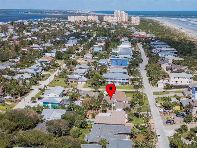 birds eye view of property with a water view and a residential view