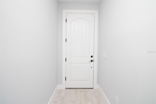 entryway featuring light wood-type flooring and baseboards