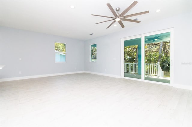 spare room featuring baseboards, wood finished floors, recessed lighting, and ceiling fan
