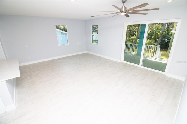 unfurnished room featuring baseboards, a ceiling fan, light wood-style floors, and recessed lighting