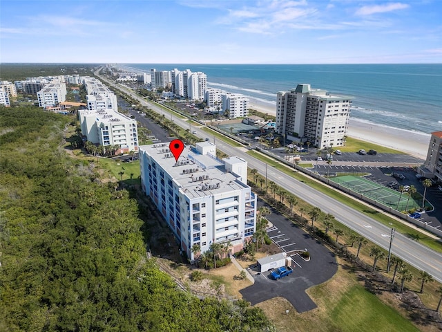 birds eye view of property featuring a view of city and a water view
