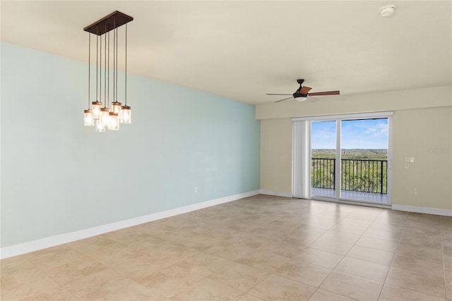 spare room with light tile patterned floors, baseboards, and ceiling fan with notable chandelier
