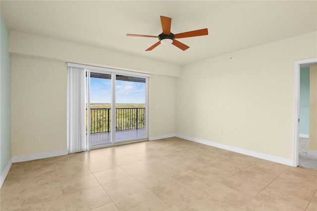 unfurnished room with light tile patterned flooring, ceiling fan, and baseboards