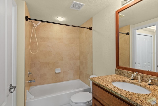 bathroom with toilet, visible vents, vanity, and  shower combination