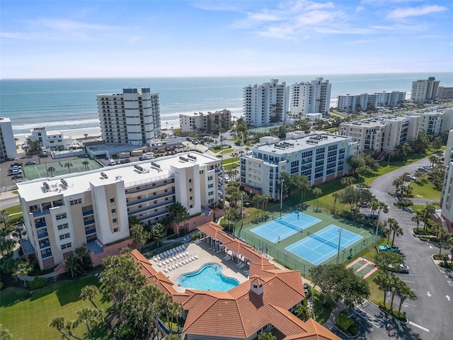 birds eye view of property with a view of city and a water view