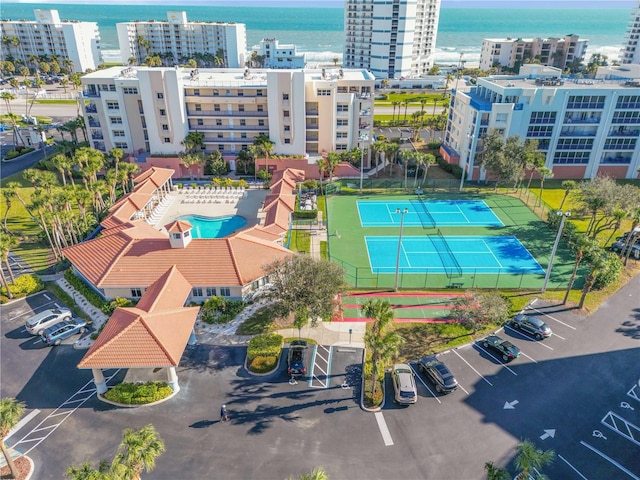 birds eye view of property featuring a view of city and a water view