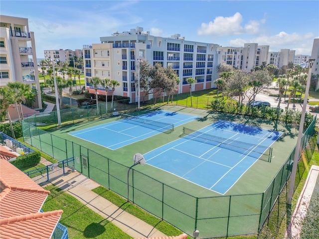 view of sport court featuring fence