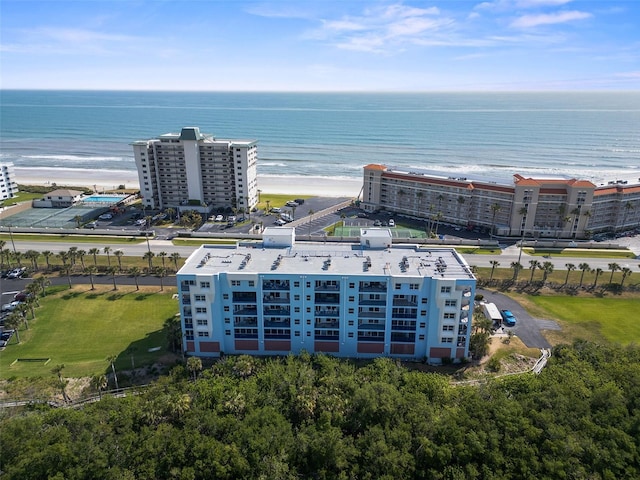 birds eye view of property featuring a view of the beach and a water view