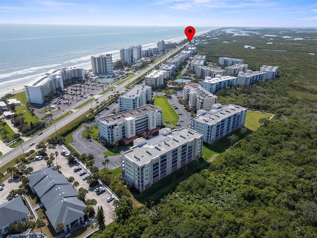 birds eye view of property featuring a water view and a city view