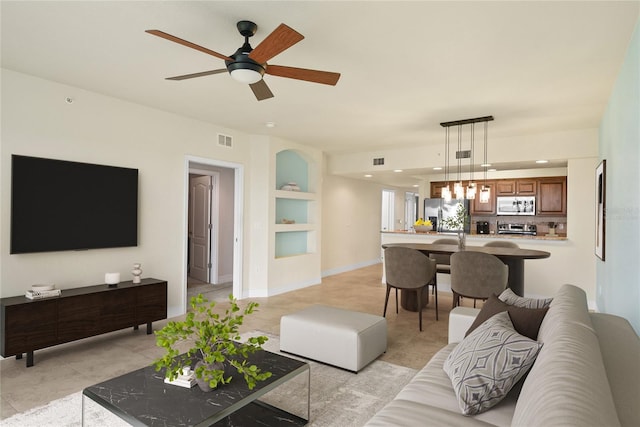 5300 S Atlantic Ave Unit 19-403, New Smyrna Beach, FL 32169 - living room featuring light tile patterned flooring, a ceiling fan, built in features, recessed lighting, and baseboards