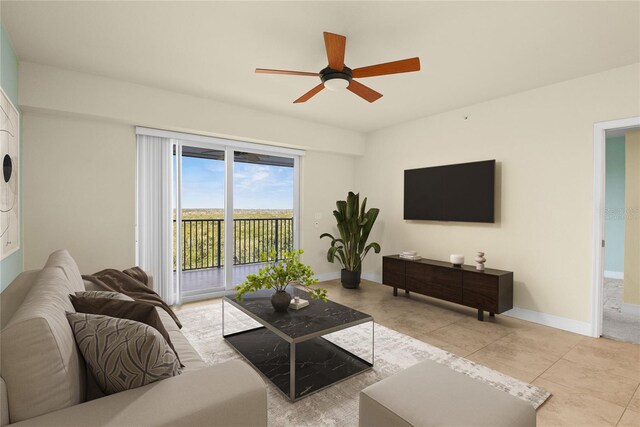 5300 S Atlantic Ave Unit 19-403, New Smyrna Beach, FL 32169 - living room featuring a ceiling fan, tile patterned flooring, and baseboards