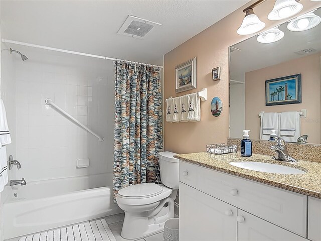 3145 S Atlantic Ave Unit 1001, Daytona Beach, FL 32118 - full bath featuring tile patterned floors, shower / bathtub combination with curtain, toilet, vanity, and visible vents