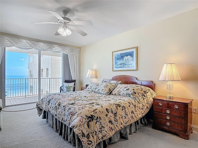 3145 S Atlantic Ave Unit 1001, Daytona Beach, FL 32118 - carpeted bedroom with ceiling fan and access to exterior