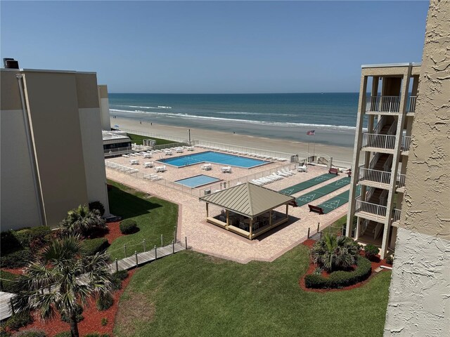 4175 S Atlantic Ave Unit 5280, New Smyrna Beach, FL 32169 - view of pool with view of water and beach and a yard