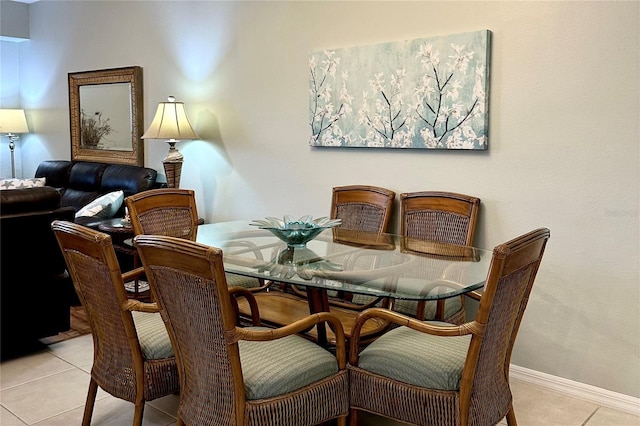 5300 S Atlantic Ave Unit 8-402, New Smyrna Beach, FL 32169 - dining area featuring light tile patterned floors and baseboards
